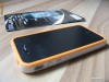 Bumper Iphone 4 / 4S Cu butoane Metalice Extra Calitate Alb cu Portocaliu    + Cadou Folie Fata Spate ( Screen Protector and Back )