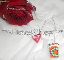 Lantisor Starbucks Coffee portocaliu foto
